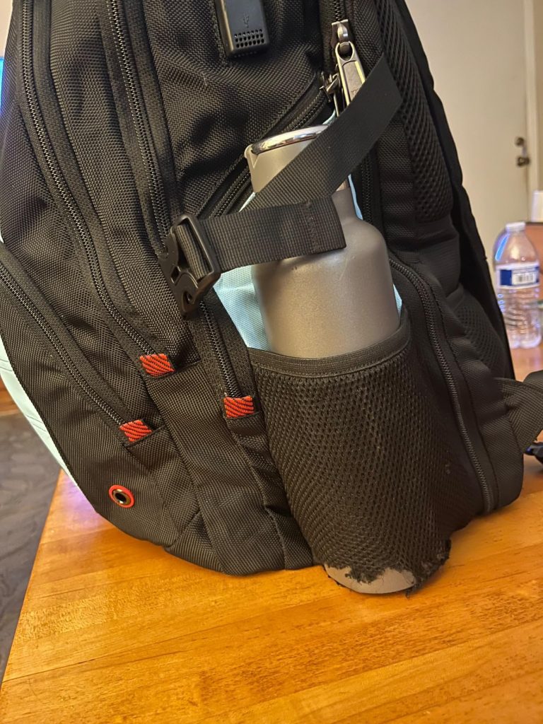 z-mgkiss travel backpack on table top