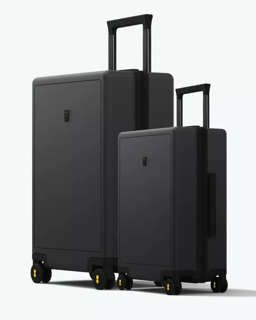 Two black Level8 Textured suitcases, a carry-on and a larger check-in, displayed side by side with extended handles.