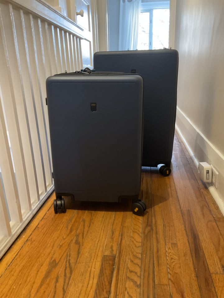 Level8 suitcases positioned in a hallway with natural light, showcasing their square shape and smooth wheels.