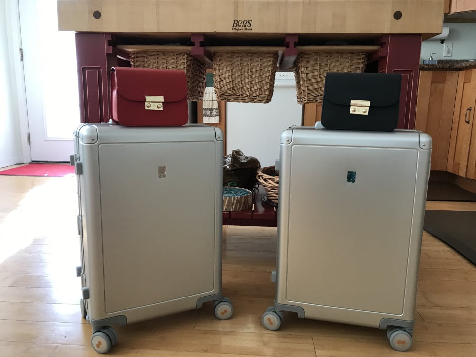 Level8 Gibraltar Aluminum Carry-On Review 6 Two Level8 Gibraltar aluminum carry-on suitcases standing upright on hardwood floor