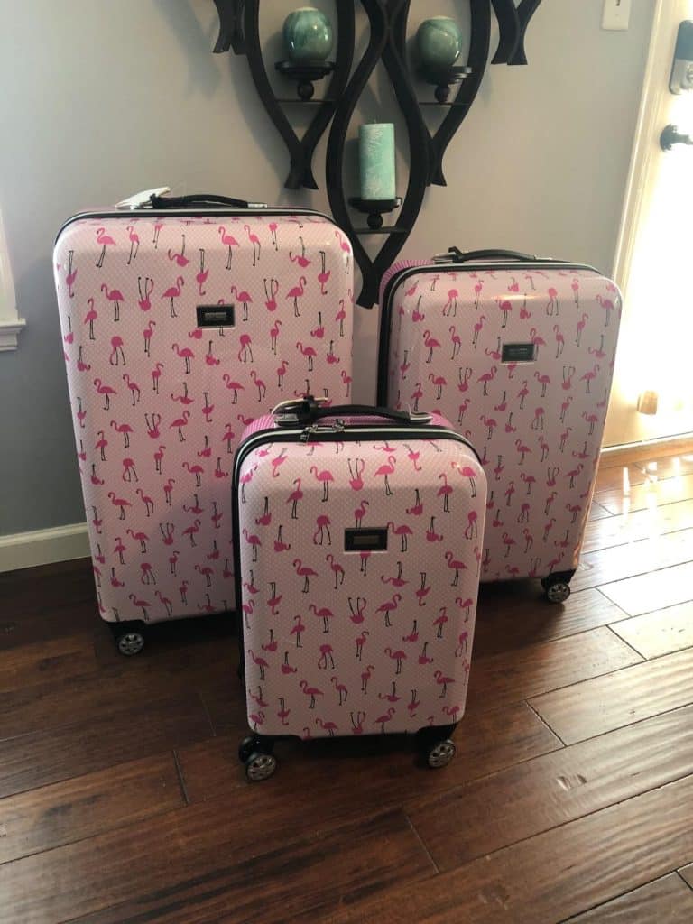 Betsey Johnson flamingo print luggage set with spinner wheels in pink hardshell design