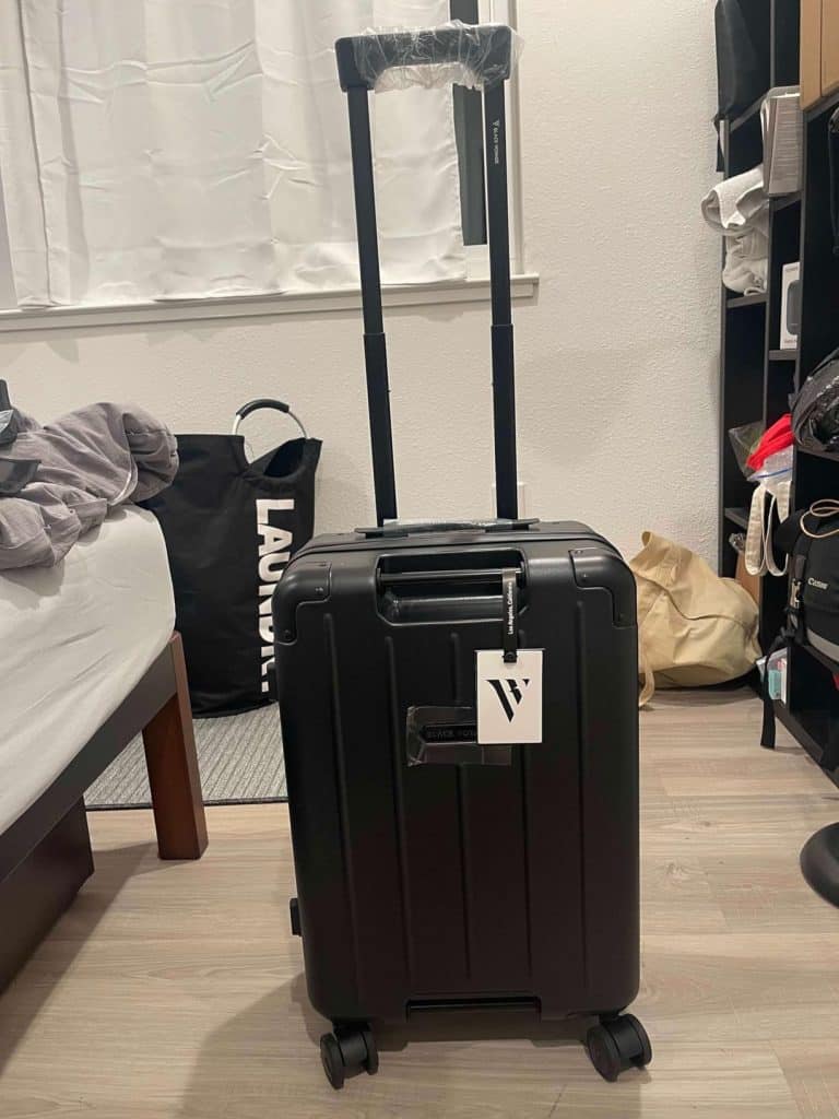BlackVoyage Air Vacuum Seal 20-inch carry-on suitcase with extended telescopic handle in matte black