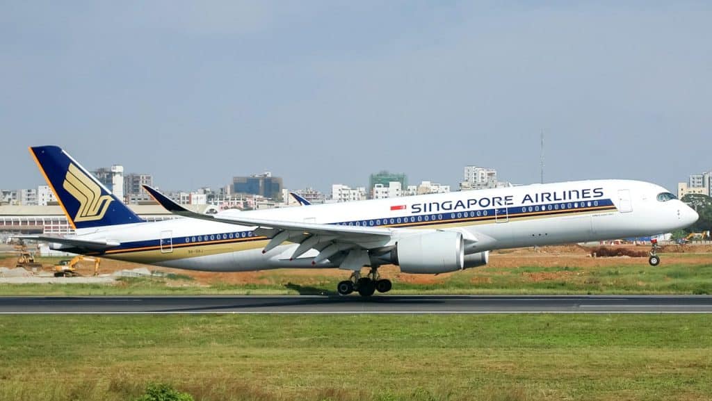 Best Carry-On Luggage for Singapore Airlines 5 Singapore Airlines aircraft on runway, highlighting international flights and carry-on luggage requirements