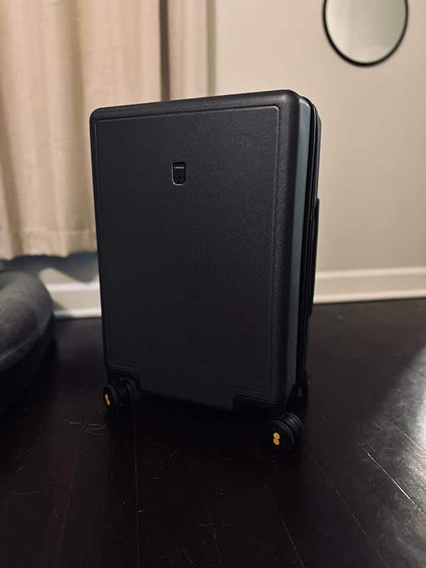 Level8 Luminous Checked 24 inch suitcase in black with diamond textured polycarbonate shell and spinner wheels