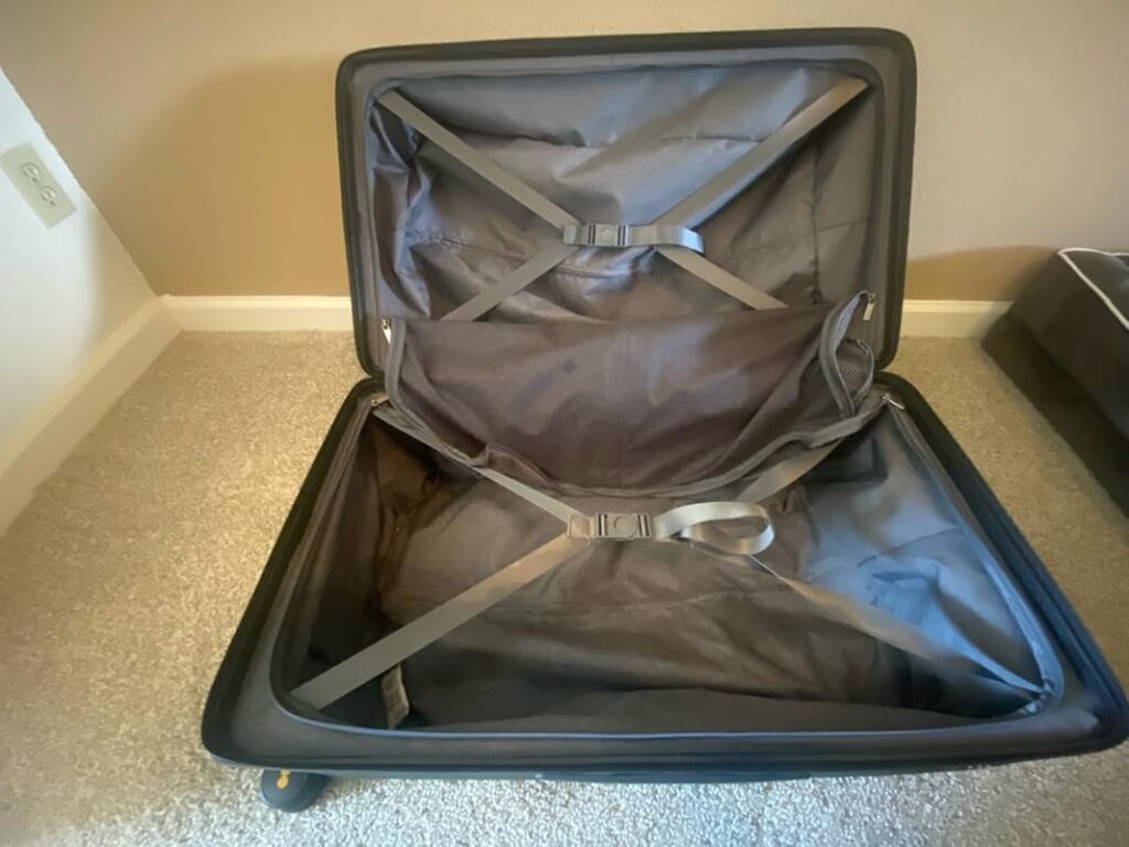 Level8 Luminous Checked 24” Review – Durable Makrolon® Polycarbonate Check-In Suitcase 7 Level8 Luminous 24 inch check-in luggage interior with divider panel, compression straps, and zippered pockets