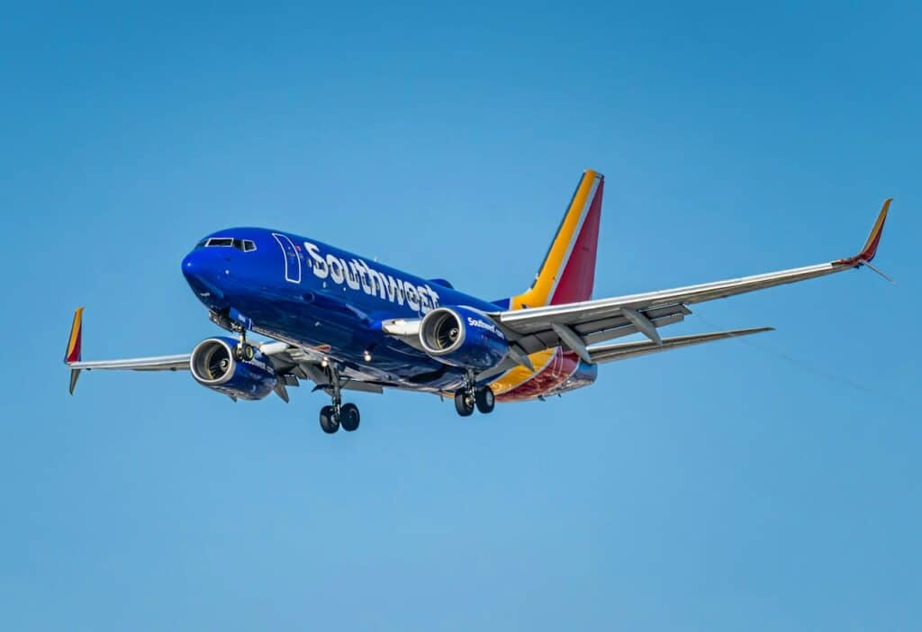 Southwest Airlines Boeing 737 aircraft in flight against a clear blue sky
