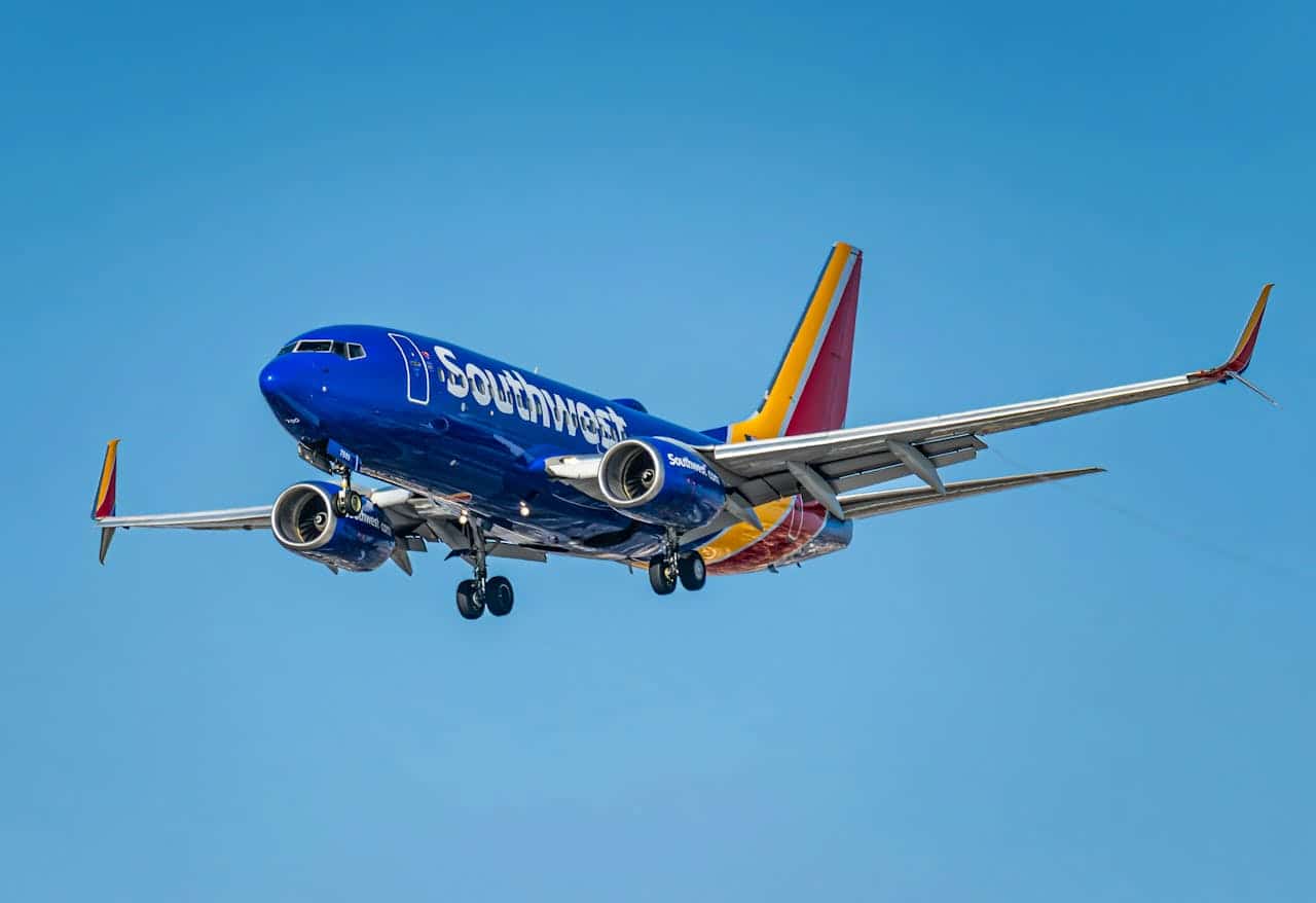 Southwest Airlines Boeing 737 aircraft in flight against a clear blue sky