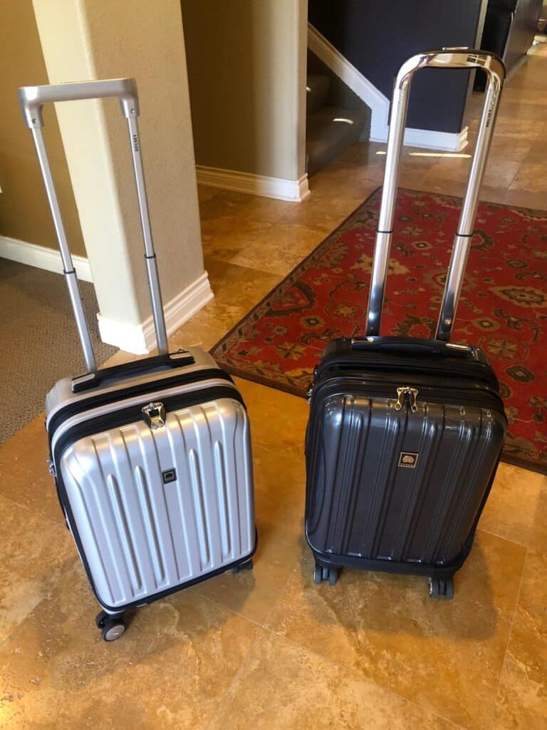 Antler Soft Stripe carry on luggage in silver and black with telescoping handles extended