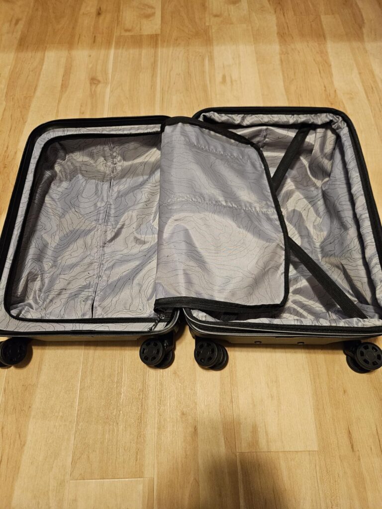 Eddie Bauer Glacier Carry-On Luggage Review 7 Interior of Eddie Bauer Glacier carry-on luggage showing split compartments with zip divider and compression straps