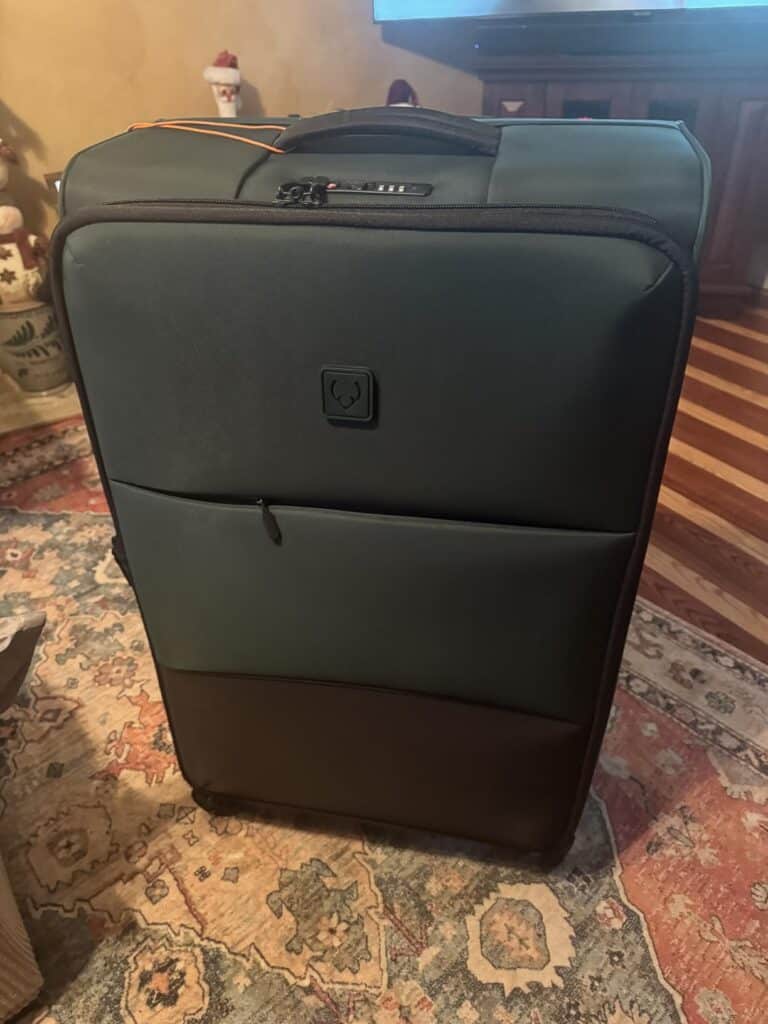 Antler Soft Stripe Carry-On luggage in dark green with front zip pocket and built-in TSA combination lock.
